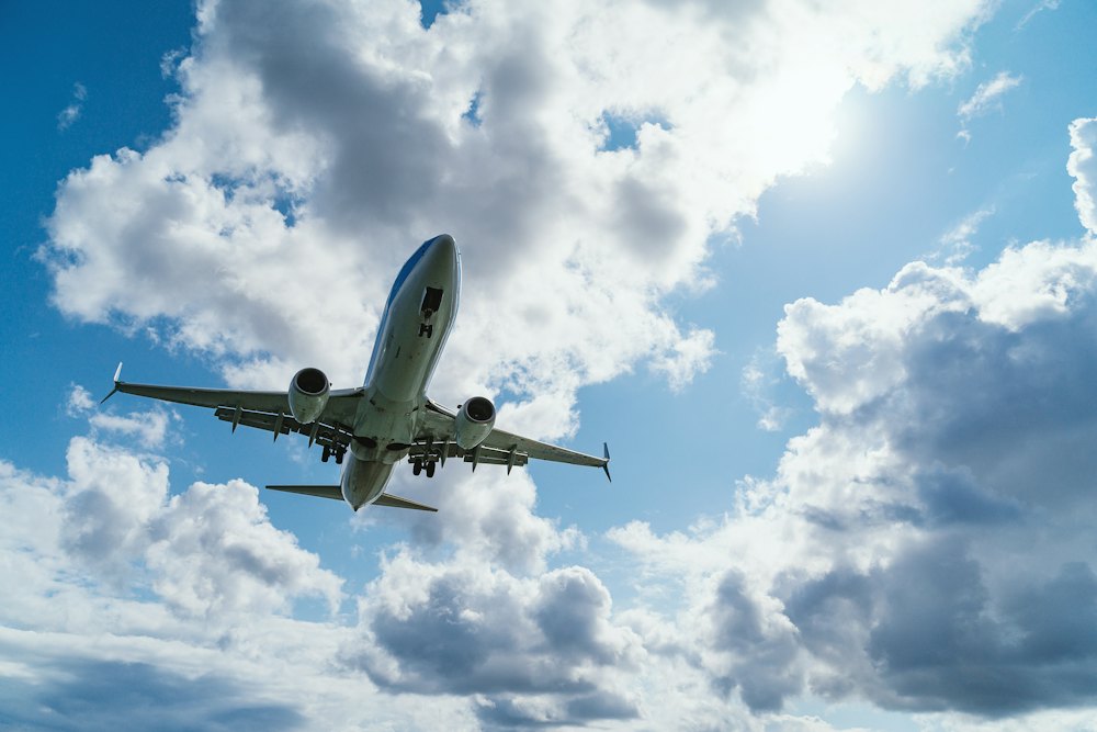 Aircraft climbing through a bright sky